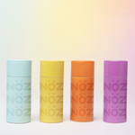 Load image into Gallery viewer, Nöz sticks sunscreen in four colors; blue, yellow, orange, and purple. Just the exterior.
